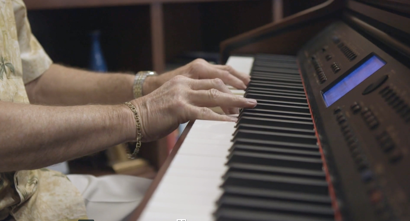 Elderly person playing the piano
