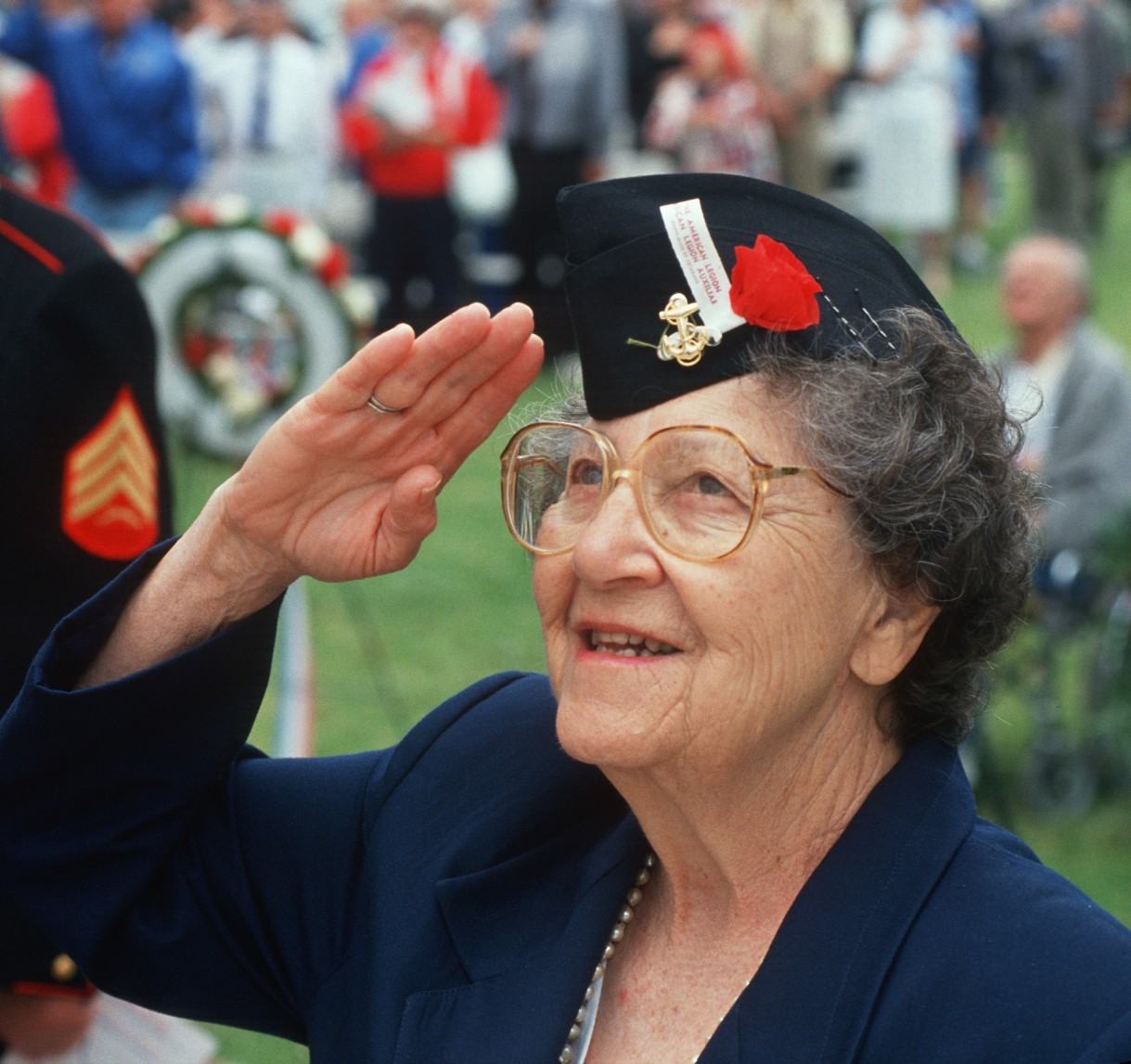 senior veteran woman saluting the flag